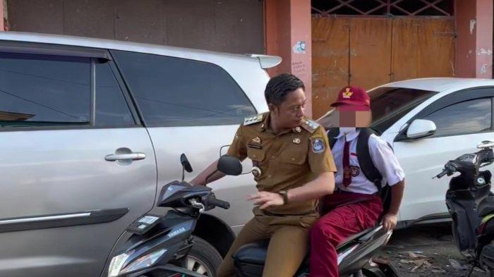 Bupati Enrekang berboncengan motor tanpa helm saat antar anak ke sekolah