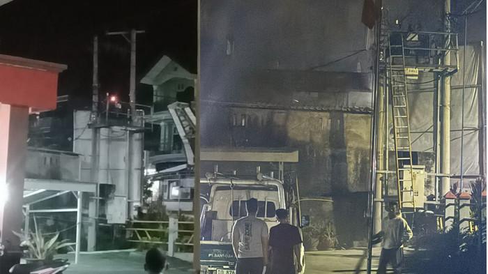 Trafo terbakar di Pantan Makale depan kantor Golkar, petugas PLN memadamkan api.